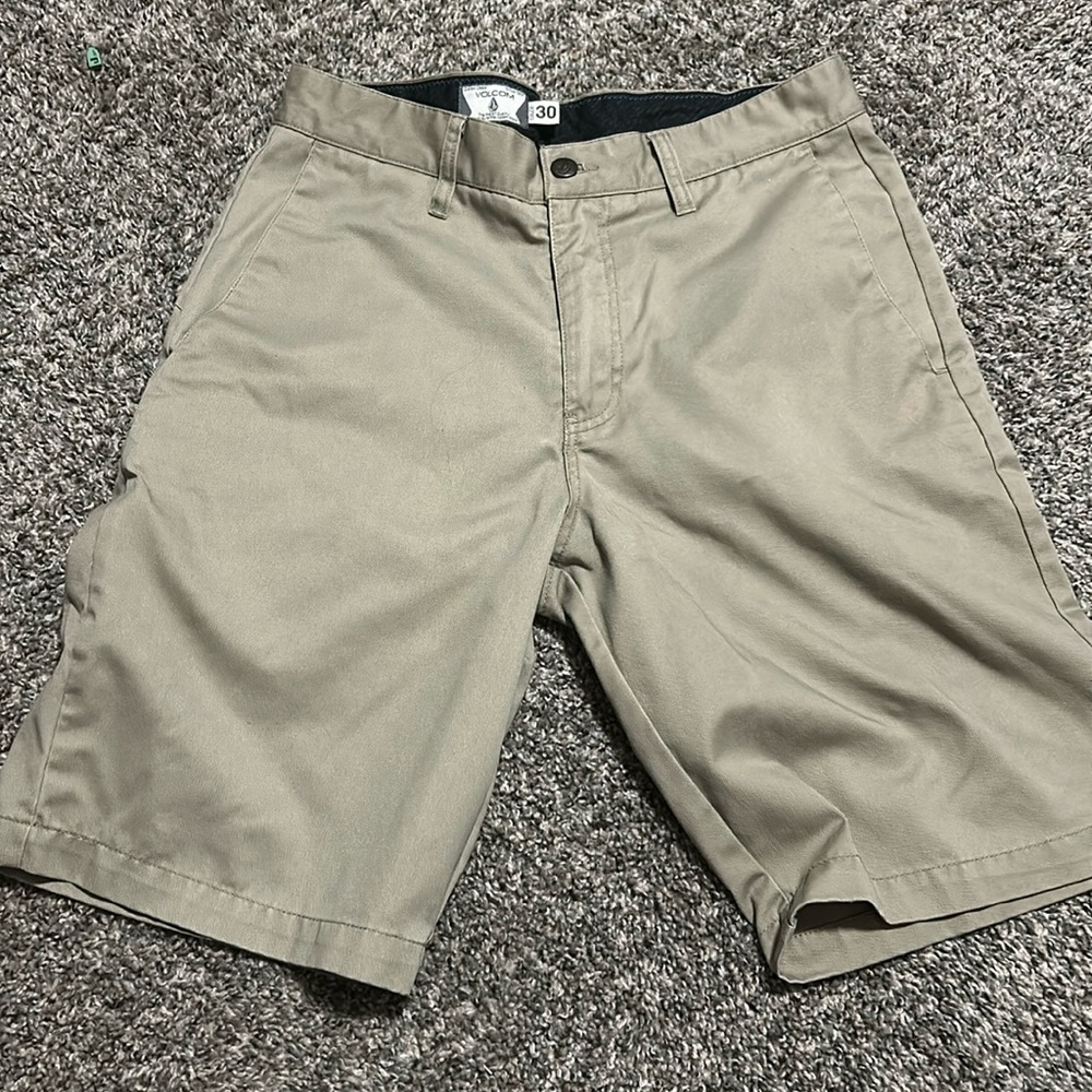 A pair of Volcom shorts as a size 30 for men.
